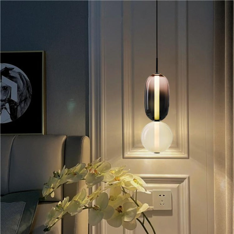 Suspension en verre ovale Syro – LED bicolore, dix combinaisons de couleurs